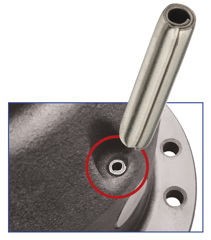 SPIROL Coiled Spring Pin retains a pinion shaft in a differential carrier assembly.